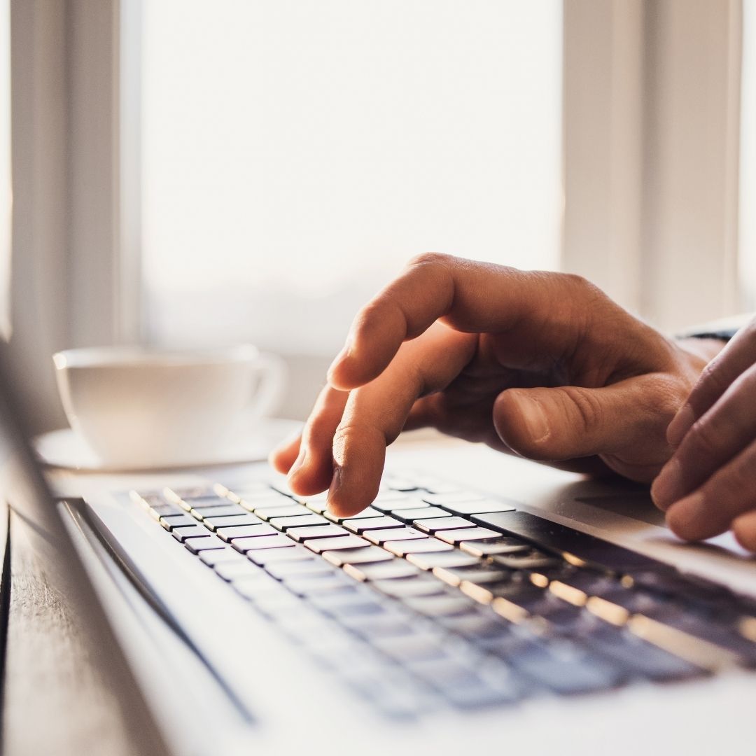 Typing on laptop