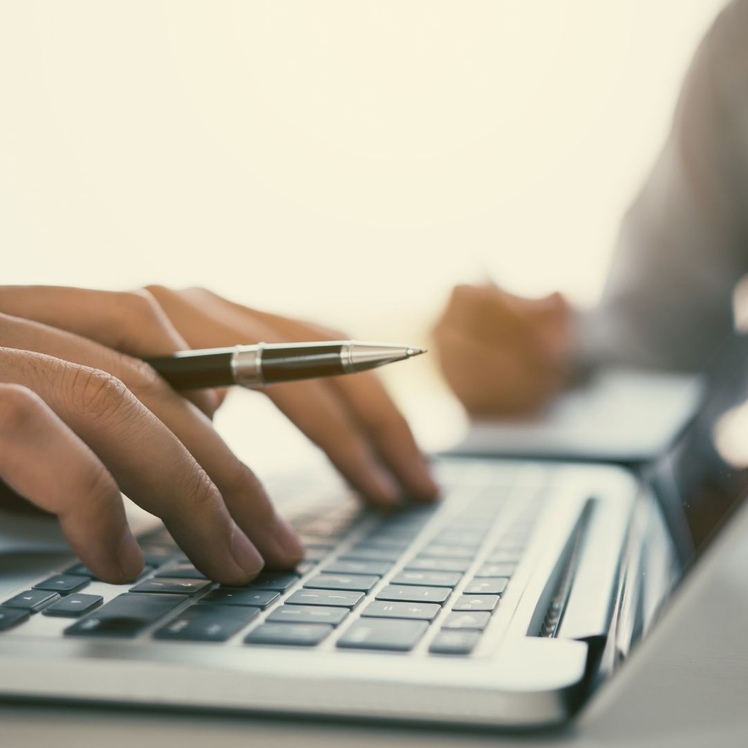 Typing on laptop