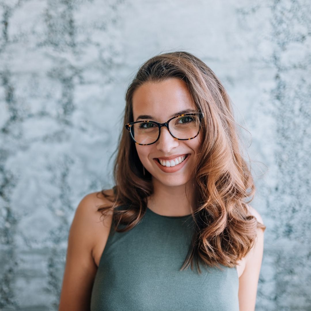 A headshot of woman in glasses.